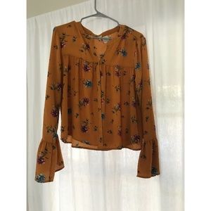 Floral mustard color top with ruffle sleeves